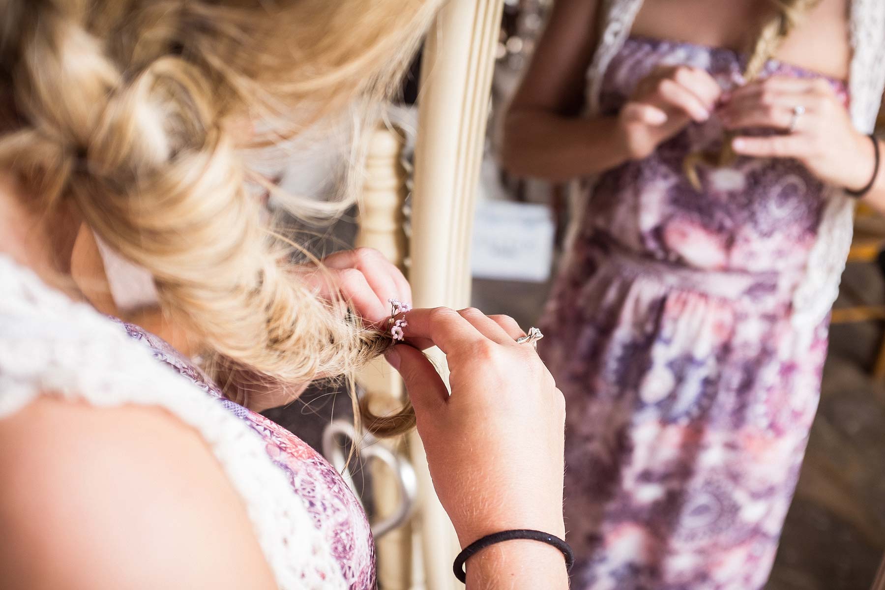 Capturing photos showing the detail of the bridal hair at Weston Park in Staffordshire by Documentary Wedding Photographer Stuart James