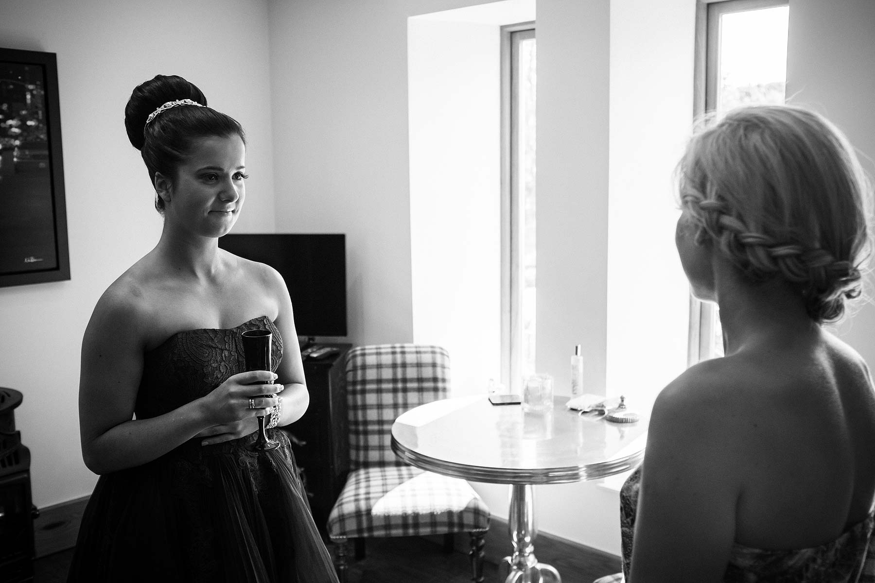 Reportage photographs of morning preparations at home capturing the makeup and finishing touches being applied at Weston Park in Staffordshire by Staffordshire Wedding Photojournalist Stuart James