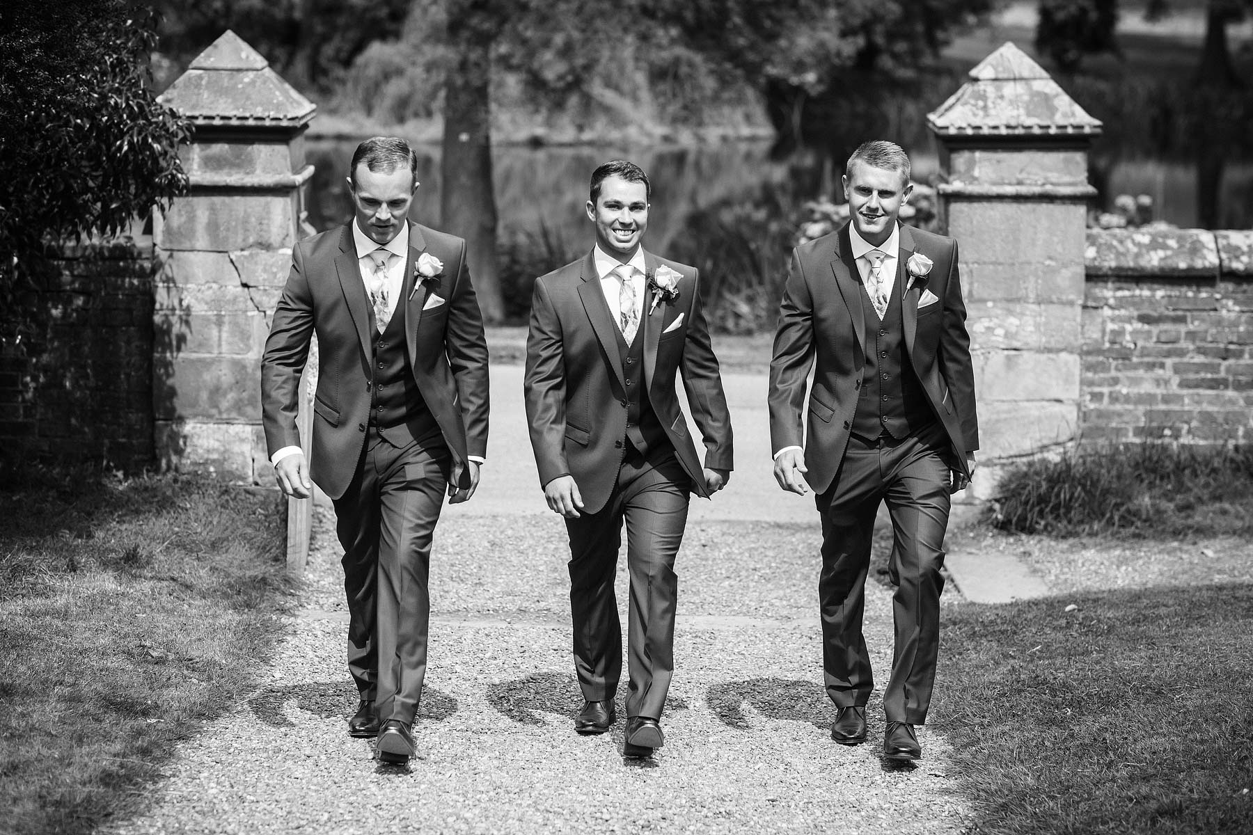 Grooms arrival at St Andrews Church with Best Men at Weston Park in Staffordshire by Candid Wedding Photographer Stuart James