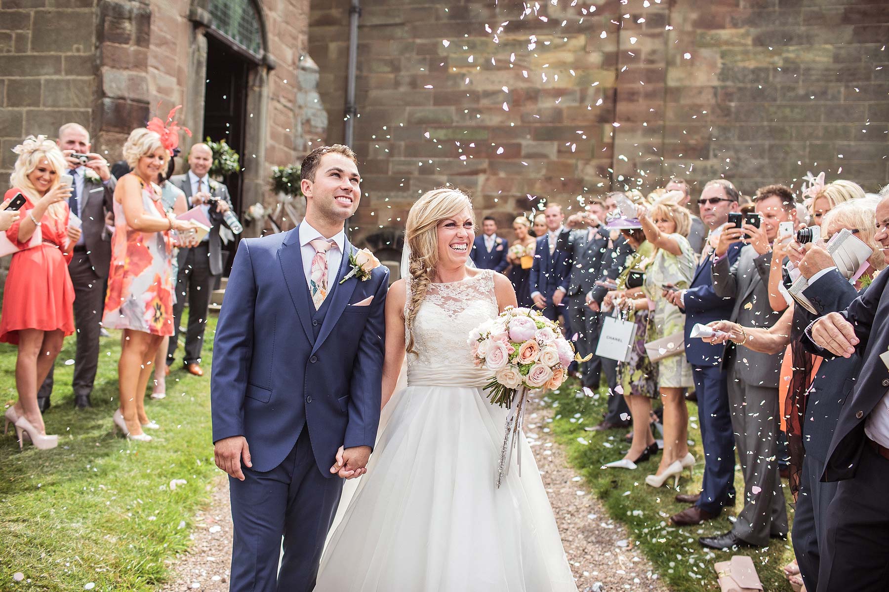 Photograph of wedding confetti at St Andrews Church Weston Park in Staffordshire by Documentary Wedding Photographer Stuart James