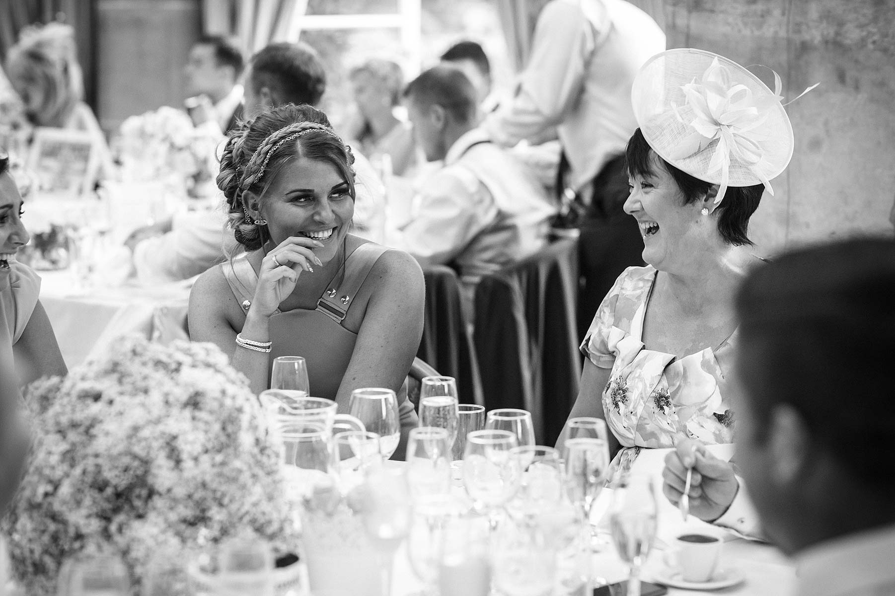 Candid photographs of guests enjoying meal at Weston Park in Staffordshire by Stafford Wedding Photographer Stuart James