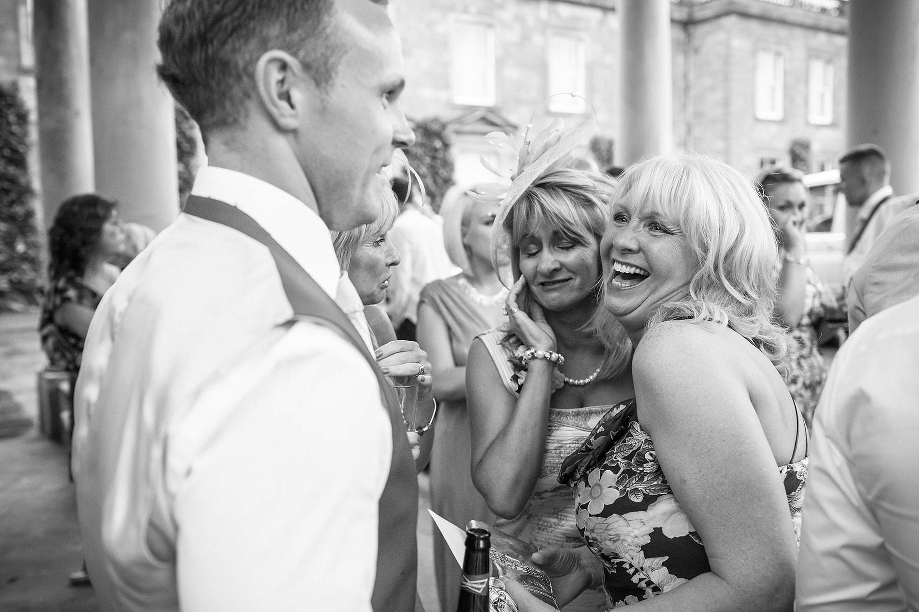 Candid photographs of guests enjoying evening reception at Weston Park in Weston-under-Lizard by Staffordshire Wedding Photographer Stuart James