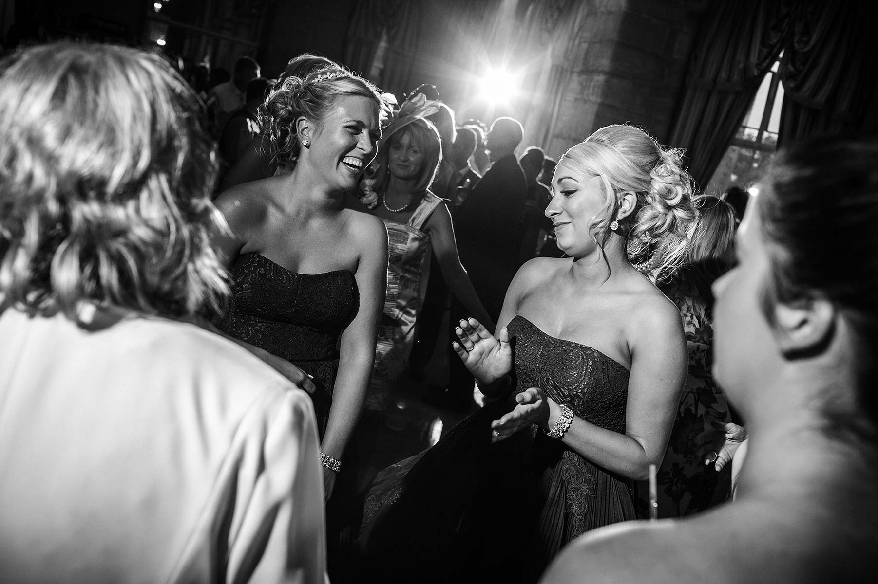 Reportage photographs of guests enjoying fantastic evenings reception at Weston Park in Weston-under-Lizard by Documentary Wedding Photographer Stuart James
