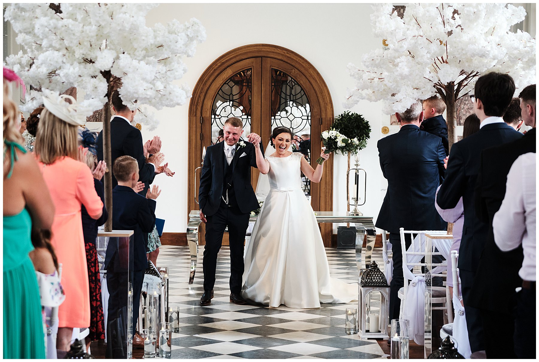 Exiting in style with the best reactions at Hawkstone Hall in Shrewsbury by Documentary Wedding Photographer Stuart James