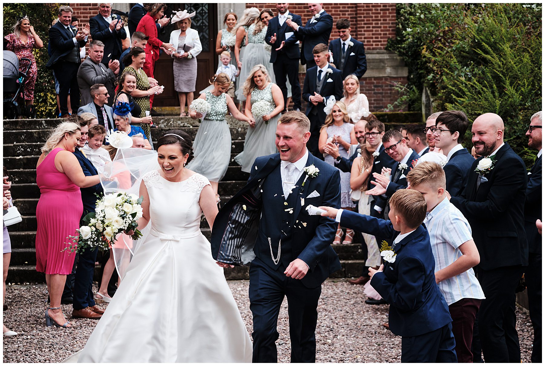 Confetti exit at Hawkstone Hall in Shrewsbury by Documentary Wedding Photographer Stuart James